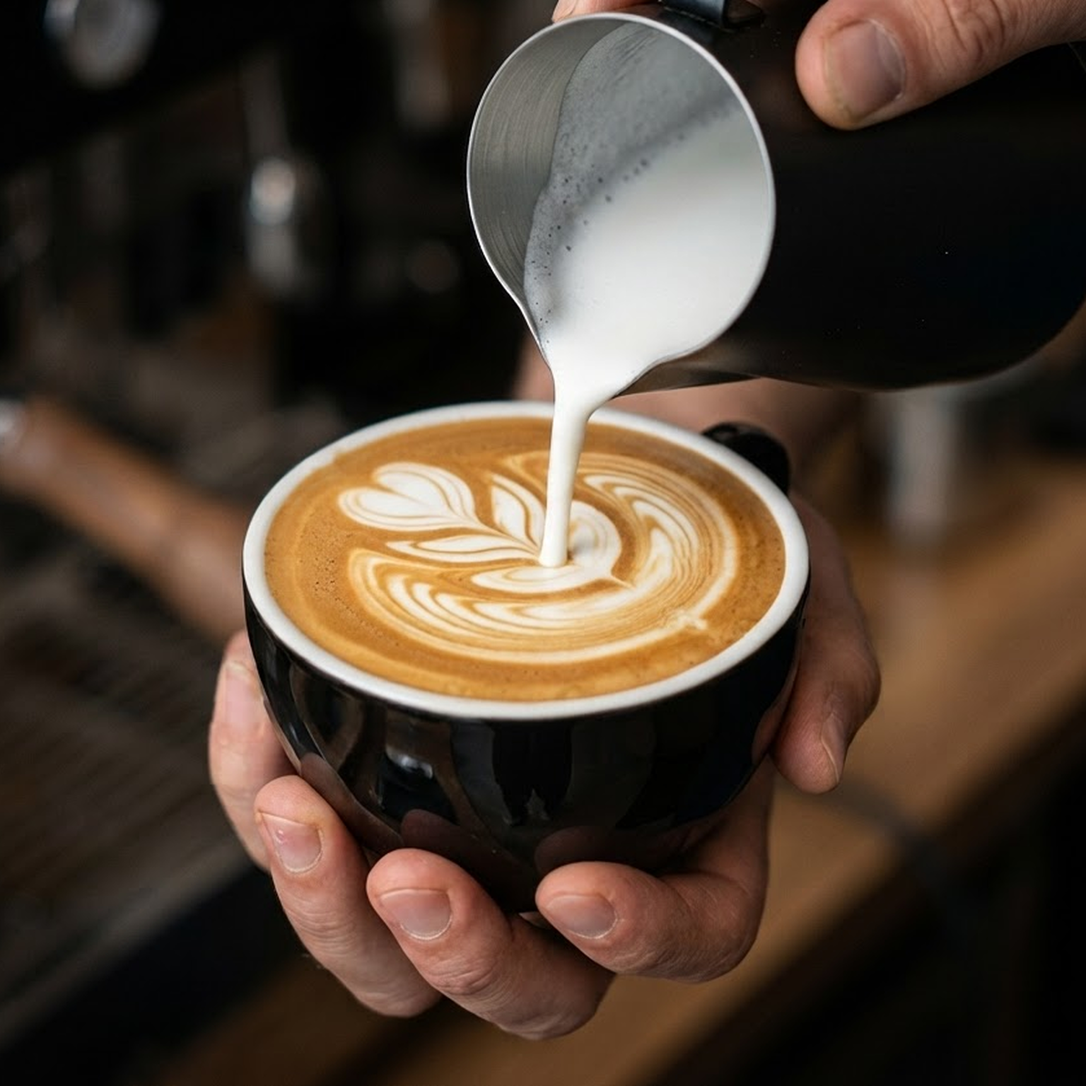 Barista pouring latte art